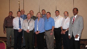 Newly elected 2012 chapter officers at the March meeting are (front row, l-r) Jason Irving, vice president for scholarships; Don Johnson, secretary; Li McCombs, treasurer; Jerry Stahl, vice president for corporate affairs and TechNet co-char; (back row, l-r) Gabe Ruiz, first vice president; Fred Eisele, vice president for programs and program chair for TechNet; Wells Barlow, president; Rick Stevens, vice president for Young AFCEANs and university affairs; Robert Wells, technology; Dick Keats, vice president for awards; and Jerry Sirmans, vice president for military affairs.